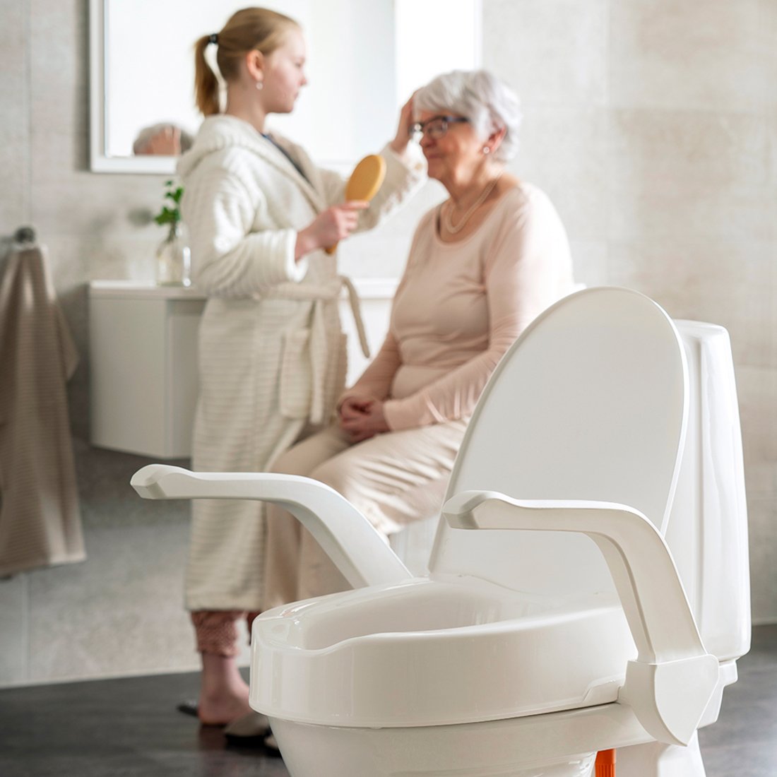 Etac My-Loo fixed Child and lady in bathroom